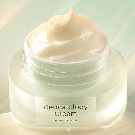 Close-up of a swirl of ICD Dermatology Cream inside its open jar, showing the cream's rich, whipped texture