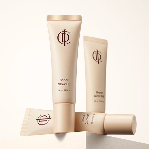 Three tubes of ICD Sheer Glow BB shown at different angles on a neutral background